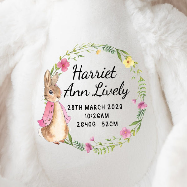 A white bunny soft toy with new baby birth announcement in a Flopsy Rabbit design, lovingly made by Ayla & Lara.