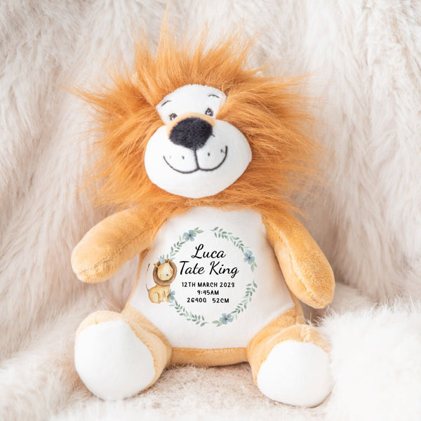 A lion teddy soft toy with personalised baby announcement details.